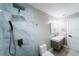 A modern bathroom features a walk-in shower with marble tile, a vanity with sink, and new fixtures at 4616 34Th E Ave, Bradenton, FL 34208