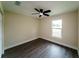 A bright bedroom features modern gray flooring and a ceiling fan at 4616 34Th E Ave, Bradenton, FL 34208