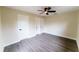Comfortable bedroom with vinyl plank flooring, fresh paint, and a modern ceiling fan at 4616 34Th E Ave, Bradenton, FL 34208
