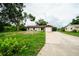 Traditional single Gathering home with a long driveway, mature landscaping, and neutral paint at 4616 34Th E Ave, Bradenton, FL 34208