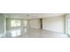Open-concept living area with tile flooring, freshly painted walls, and new trim at 4616 34Th E Ave, Bradenton, FL 34208