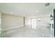 Bright and airy living room features tile floors, recessed lighting, and neutral walls at 4616 34Th E Ave, Bradenton, FL 34208