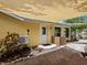 Exterior of house with a backyard and a covered patio at 4830 Estrada De Costa, Sarasota, FL 34242