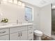 Bright bathroom with white vanity, quartz counters, and terracotta floors at 4830 Estrada De Costa, Sarasota, FL 34242
