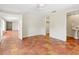 Bright bedroom featuring unique terracotta tile floors, white walls, and access to bathroom at 4830 Estrada De Costa, Sarasota, FL 34242