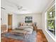 Cozy bedroom with a neutral color scheme, ensuite bathroom and natural light from a large window at 4830 Estrada De Costa, Sarasota, FL 34242