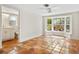 Bedroom with bay window, terracotta tile, and bathroom access at 4830 Estrada De Costa, Sarasota, FL 34242