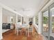 Bright dining room with seating for four, tile floors and sliding glass doors to the outdoor patio at 4830 Estrada De Costa, Sarasota, FL 34242