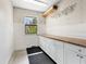 Well-lit workshop area with cabinets and counter space, perfect for hobbies and projects in the garage at 4830 Estrada De Costa, Sarasota, FL 34242