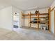 Clean and organized garage interior with shelving, providing functional space for storage and projects at 4830 Estrada De Costa, Sarasota, FL 34242