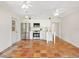 Spacious kitchen with white cabinets, stainless steel appliances, and terracotta tile floors at 4830 Estrada De Costa, Sarasota, FL 34242