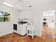 Laundry room with terracotta tile flooring and stainless steel appliances at 4830 Estrada De Costa, Sarasota, FL 34242