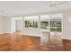 Open concept living room with tile floors, neutral paint, ceiling fans, and a view of the water at 4830 Estrada De Costa, Sarasota, FL 34242