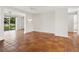 Large living room with neutral paint, tile floors, and glass doors leading to a back patio at 4830 Estrada De Costa, Sarasota, FL 34242