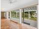 Bright sun room featuring tile floors, neutral paint, and floor-to-ceiling sliding glass doors at 4830 Estrada De Costa, Sarasota, FL 34242