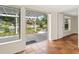 Bright sun room featuring tile floors, neutral paint, and floor-to-ceiling sliding glass doors at 4830 Estrada De Costa, Sarasota, FL 34242