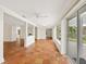 Bright sun room featuring tile floors, neutral paint, and floor-to-ceiling sliding glass doors at 4830 Estrada De Costa, Sarasota, FL 34242