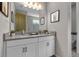 Bright bathroom featuring double sink vanity, framed art, and modern fixtures at 4869 Antrim Dr, Sarasota, FL 34240