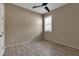 Bedroom featuring a modern ceiling fan, shuttered windows, and wood-look tile flooring at 4869 Antrim Dr, Sarasota, FL 34240