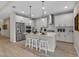 Modern kitchen with white cabinets, stainless steel appliances, and a central island with seating at 4869 Antrim Dr, Sarasota, FL 34240