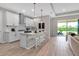 Bright, modern kitchen featuring a center island with seating and stainless steel appliances at 4869 Antrim Dr, Sarasota, FL 34240