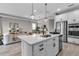Bright, open kitchen with an island, stainless appliances, and seamless flow into the adjacent living area at 4869 Antrim Dr, Sarasota, FL 34240
