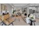 Open-concept living room with stylish decor and a seamless flow into the dining and kitchen areas at 4869 Antrim Dr, Sarasota, FL 34240