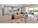 Comfortable living room with bar seating and view to outdoor patio at 4869 Antrim Dr, Sarasota, FL 34240