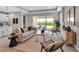 Open-concept living room featuring modern decor and access to an outdoor patio at 4869 Antrim Dr, Sarasota, FL 34240