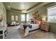 Spacious main bedroom features a decorative light fixture, an area rug, and a wooden headboard at 4869 Antrim Dr, Sarasota, FL 34240
