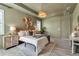 This main bedroom is spacious with a decorative chandelier, a neutral rug, and muted green walls at 4869 Antrim Dr, Sarasota, FL 34240