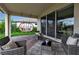 Outdoor living with a covered patio and comfortable seating and hanging swing at 4869 Antrim Dr, Sarasota, FL 34240
