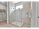 Modern glass shower with tiled walls, a window, and neutral flooring at 4869 Antrim Dr, Sarasota, FL 34240