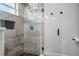 Bathroom featuring modern glass shower with gray tiling and a window at 4920 69Th N St, St Petersburg, FL 33709