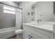 This bathroom features a tiled shower-tub and a modern vanity with a white countertop at 4920 69Th N St, St Petersburg, FL 33709