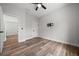 This bedroom features wood-look flooring and a TV mount at 4920 69Th N St, St Petersburg, FL 33709