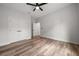 This bedroom features wood-look flooring and a walk-in closet at 4920 69Th N St, St Petersburg, FL 33709