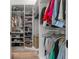 Walk-in closet with custom shelving, storage, and clothing racks at 4920 69Th N St, St Petersburg, FL 33709