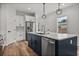 Beautiful kitchen features an island with seating, stainless steel appliances, and pendant lighting at 4920 69Th N St, St Petersburg, FL 33709