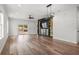 Open-concept living room with built in shelving and sliding glass doors to the backyard at 4920 69Th N St, St Petersburg, FL 33709