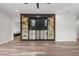 Living room with a custom built-in entertainment center and an open layout at 4920 69Th N St, St Petersburg, FL 33709