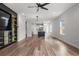 Open-concept living room featuring a view to kitchen and custom built-in entertainment center at 4920 69Th N St, St Petersburg, FL 33709