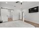 Spacious main bedroom with wood floors, sliding barn door and TV at 4920 69Th N St, St Petersburg, FL 33709