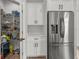 Kitchen featuring stainless steel refrigerator and pantry with wire shelving at 4920 69Th N St, St Petersburg, FL 33709