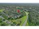 Aerial view of the surrounding area with lush greenery and trees and featuring the home at 5103 Twin Creeks Dr, Valrico, FL 33596