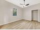 Bright bedroom featuring a ceiling fan, a window, and closet space at 5103 Twin Creeks Dr, Valrico, FL 33596