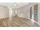 Bright room with hardwood floors and a door to the patio at 5103 Twin Creeks Dr, Valrico, FL 33596
