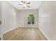 Light and bright bedroom featuring hardwood floors, neutral paint and a ceiling fan at 5103 Twin Creeks Dr, Valrico, FL 33596