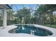 Screened-in pool and spa area boasts ample privacy with lush greenery and provides a relaxing outdoor oasis at 5103 Twin Creeks Dr, Valrico, FL 33596