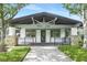 Charming community tennis club with pristine landscaping and inviting entrance at 5103 Twin Creeks Dr, Valrico, FL 33596